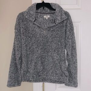 Soft Like grey/speckled white sherpa!! Super comfy, easy to throw on